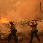 Colorado prison evacuated as growing wildfire becomes one of the largest in state history